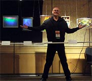 Al Razutis presents holographic art and displays at National Stereoscopic Association 3D-Con 2012,  3D Gallery - Razutis is pictured - click/enlarge in separate window